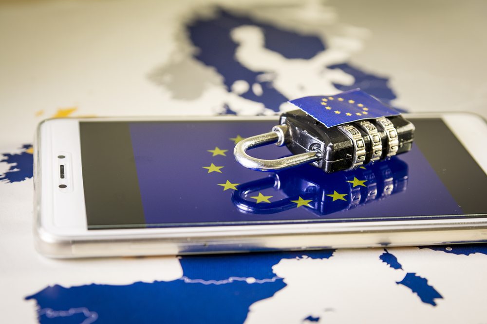 Smartphone and padlock on top of an EU map, representing the level of data protection required to be in compliance with the General Data Protection Regulation (GDPR).