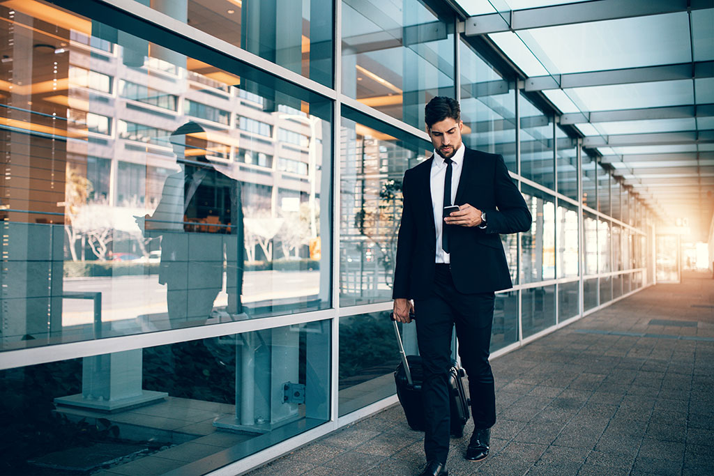 A business man with luggage.